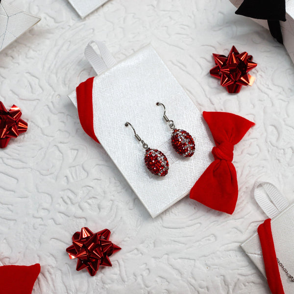 on card RED AND CLEAR CRYSTAL FOOTBALL EARRINGS