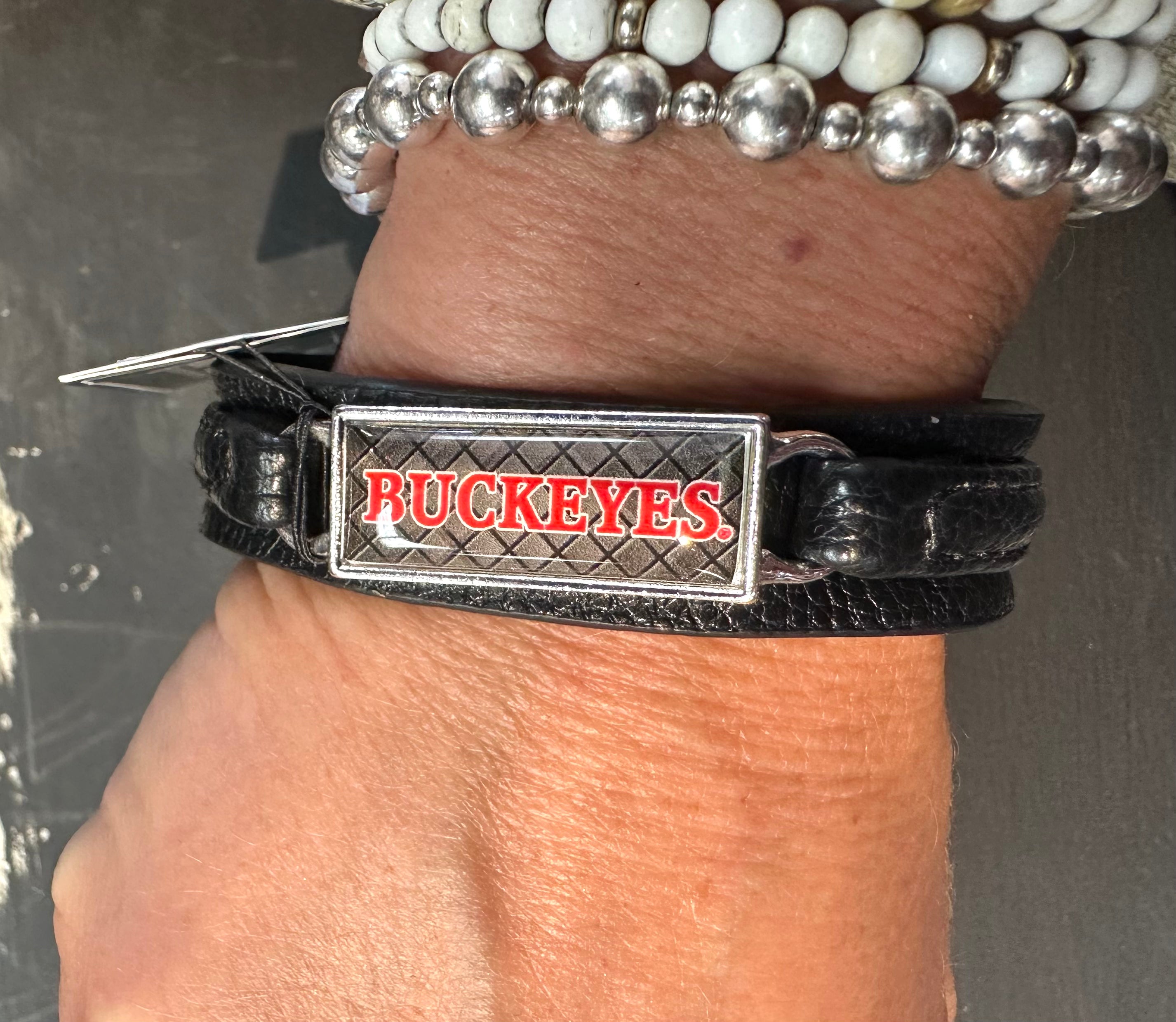 Durable Buckeye fan bracelet in black leather with logo plate