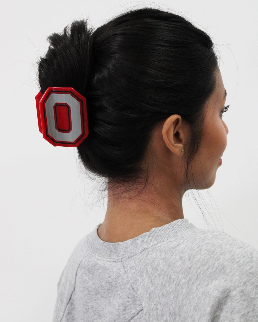 in hair red Ohio State® Block O Statement Claw Clip