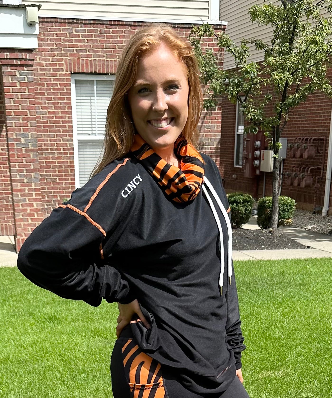 "CINCY" logo under shoulder seam
