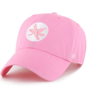 A pink baseball cap featuring a white circular patch on the front with a pink ribbon design, and a white embroidered '47' logo on the side, set against a plain white background.