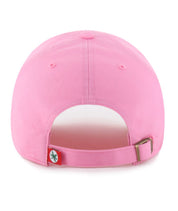 The back view of a pink baseball cap with an adjustable strap and a small red tag featuring a green logo, set against a plain white background.