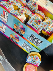Box of 'The Viral Dumpling' toy with colorful packaging on a dark surface