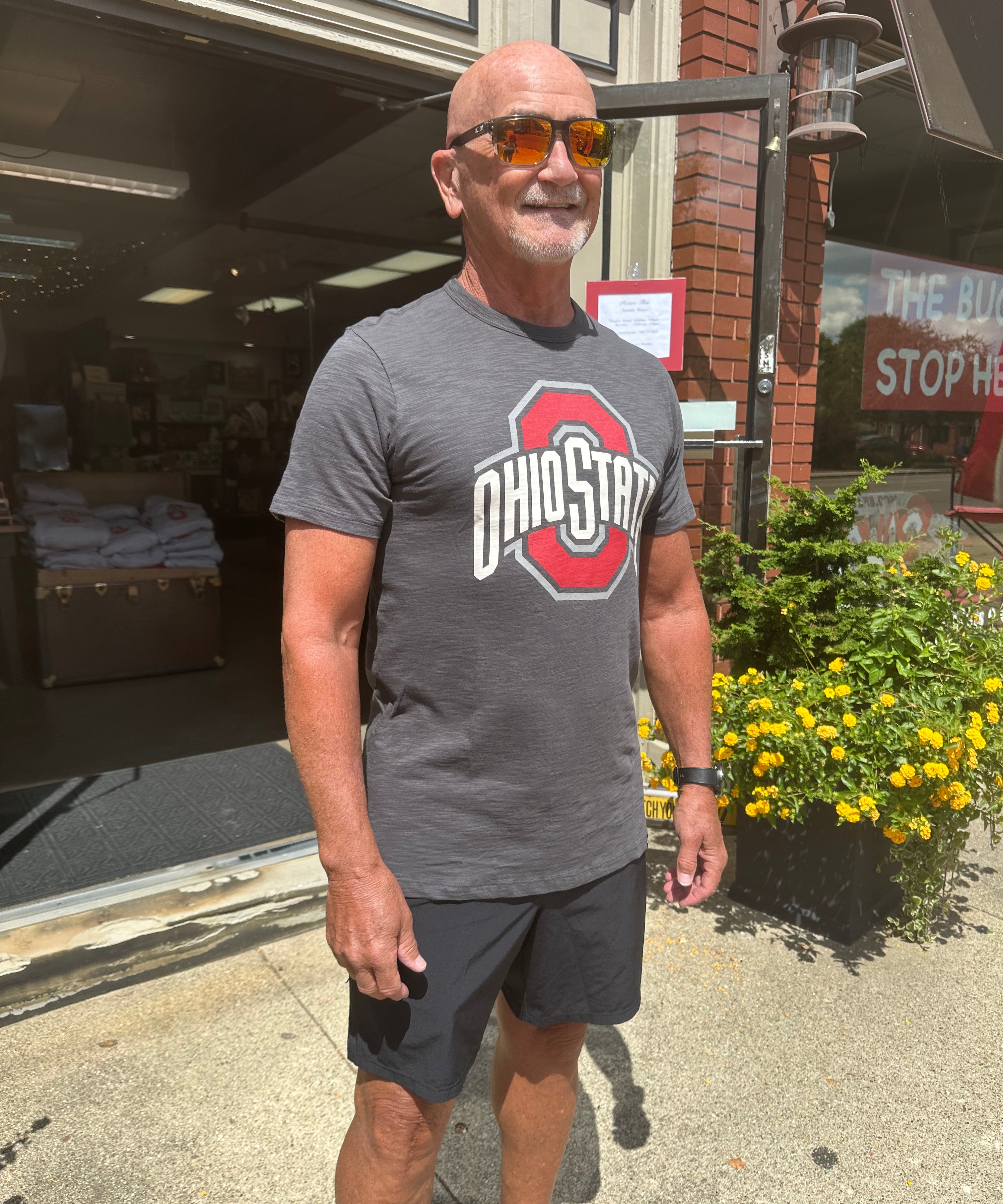 staffer wearing shirt outside of store