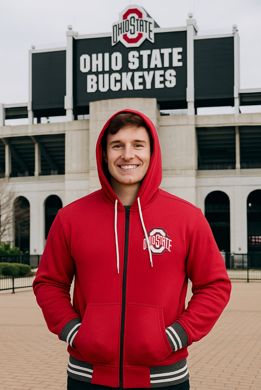 Person wearing a red Ohio State hoodie in front of the Ohio State Buckeyes stadium.