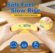 Yellow butter container with hands squeezing it on a wooden surface, featuring text about 'Soft Feel, Slow Rise'.