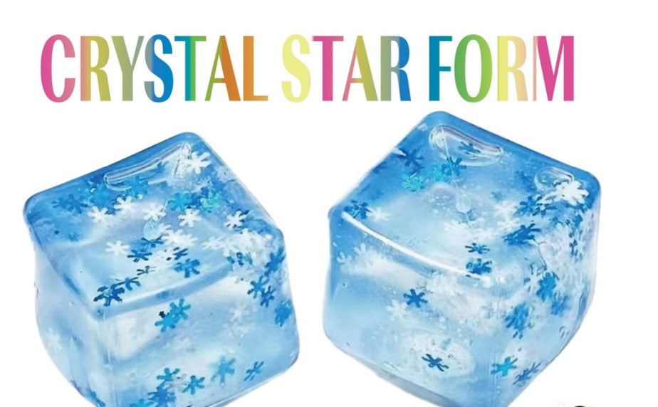 Two blue crystal star form toys with snowflake patterns on a white background.