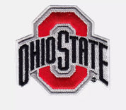 An embroidered Ohio State Buckeyes logo patch on a light gray background. The patch features a red block with black lettering reading 'OHIO STATE' and silver-gray stitched borders.