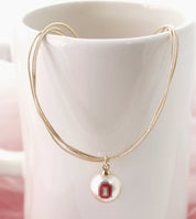 long gold necklace pearl size block O 