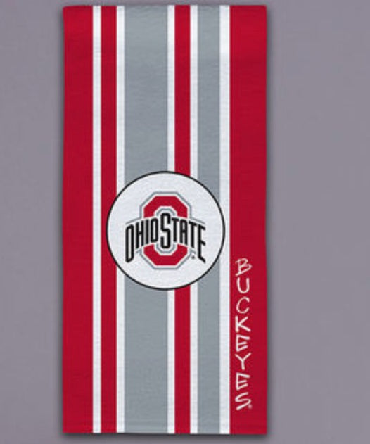 A vertical Ohio State Buckeyes themed towel featuring red and gray vertical stripes, a central circular logo with the Ohio State 'O' and text, and the word 'BUCKEYS' printed vertically on the right side, shown against a solid gray background.