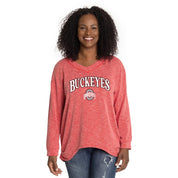 Woman wearing a red 'Buckeyes' long-sleeve shirt on a white background