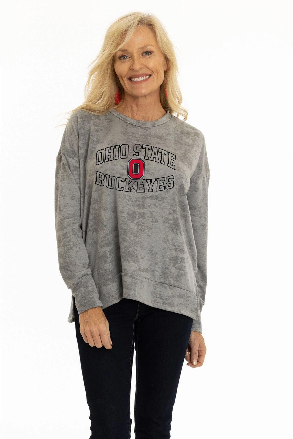 Woman wearing a gray 'Ohio State Buckeyes' sweatshirt on a white background
