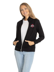 Woman wearing a black jacket with a logo on a white background